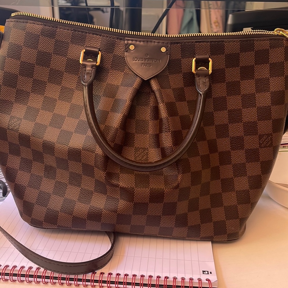 Authentic: Excellent condition authentic Louis Vuitton SIENA MM. Gently used.